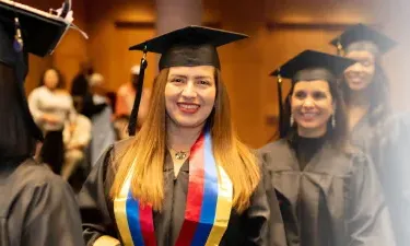 Herzing South Dakota Online BSN Student Smiling at Graduation Ceremony